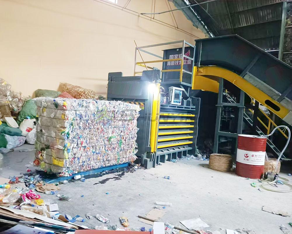 Horizontal baler perfect for compacting and recycling plastic materials.